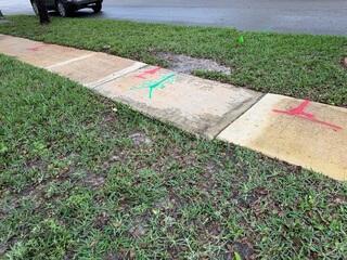 This section of the neighborhood sidewalk had settled after recent plumbing repairs nearby had caused the underlying soil to erode.