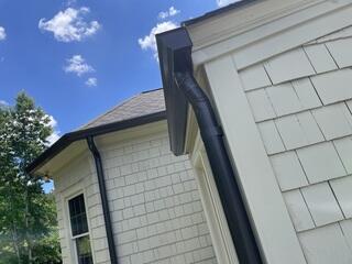 Custom black gutters installed
