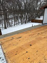 Shingles are removed down to the decking