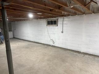 Waterproofed Wall and SaniDry XP Dehumidifier