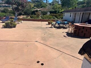 Cracked Patio Concrete Before Lifting and Sealing in Vista, CA
