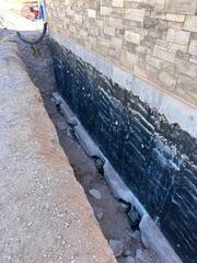 Steel Pier Bracket Installed Beneath Foundation Footing in Utah