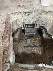 Steel Pier Bracket Installed Beneath Foundation Footing in Utah