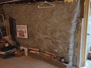 Seeping Fieldstone Foundation Wall