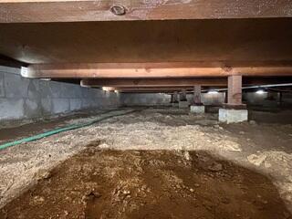 Moisture-Prone Crawl Space Before Encapsulation System Installation