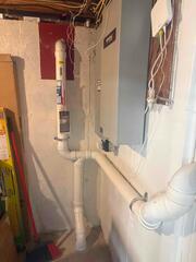 Interior Radon Piping Installed Through Utility Area