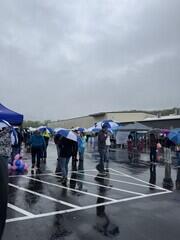 Attendees with Adirondack Basement Umbrellas