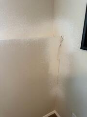 Cracking drywall over the bowing foundation wall