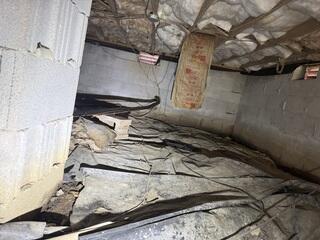 A Damp Crawl Space and Ineffective Vapor Barrier
