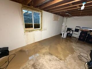 Water buildup in the window well resulted in a very wet basement.