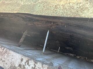 Another example of damage to the home's fascia and gutter pulling off.