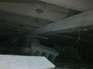 During the crawl space inspection, the LRE Design Specialist discovered that the floor joists lacked adequate structural support. The original block piers had settled, and several makeshift supports were providing little to no reliable support for the floor system above.