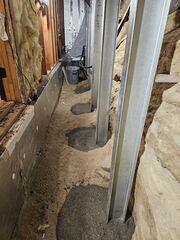 Cement is poured to hold the EverBrace posts
