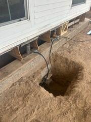 Foundation Pier Excavation Along Settling Home