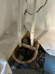 The drainage system directs water towards the TripleSafe Sump Pump, which has one pump for low water intrusion, a second pump for heavy water intrusion, and a third battery backup pump for power outages.