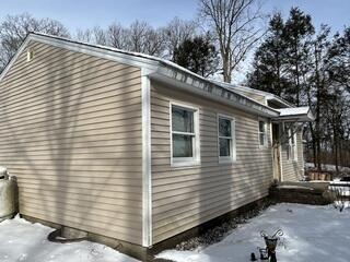 Before: Weathered Siding and Staining