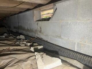 Open crawl space vents are letting outside air in. This contributes to moisture issues in the crawl space.