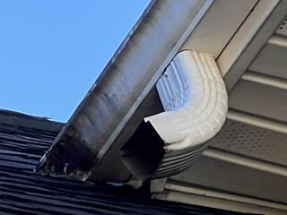 Damaged gutters by recent storms