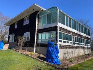 Wood siding being replaced