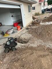 Foundation Repair Excavation Along the Home
