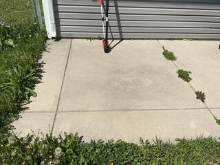 Concrete Patio Before Crack and Joint Sealant Repair