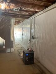 The finished basement features the CleanSpace&reg; Wall System installed along the foundation walls, helping create a brighter, cleaner appearance while directing any wall moisture into the WaterGuard&reg; Drainage System below.
