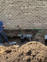 Installing Helical Piers for Foundation Support