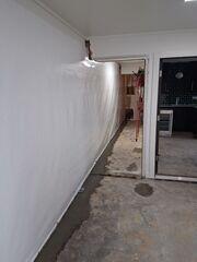 The CleanSpace Wall System with WaterGuard in the floor traps and drains water into the sump pump