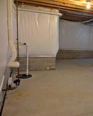 Mary's basement already had a cover drain, a sump pump, and blanket insulation. But they just weren't doing that great anymore! The basement seemed cold still, the drain would easily get clogged, and her sump didn't always seem to kick on.