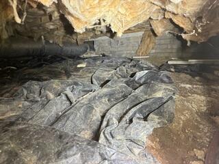With falling insulation and debris everywhere, this crawl space was in some serious need of help.