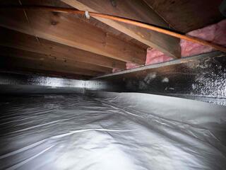 Sealing Out Ground Moisture with a Crawl Space Vapor Barrier