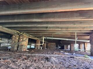 Before repairs began, the crawl space showed signs that the floor system needed additional support. Over time, weakened supports can lead to sagging floors, sticking doors, and cracks inside the home. This inspection helped identify where new structural support was needed to stabilize the home from the ground up.