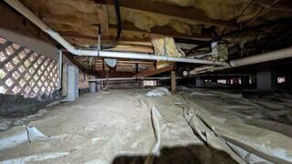 This crawl space is quite literally in the open air and offers no benefit to the home.