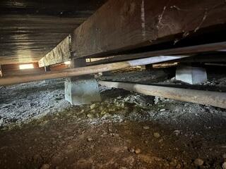Existing Crawl Space Foundation Supports Before Stabilization