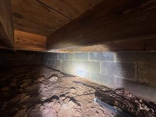 Dirty Crawl Space with Water Intrusion