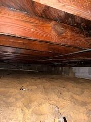 An inspection by an LRE Design Specialist revealed high levels of moisture and humidity in the crawl space due to a lack of a proper moisture regulation system.