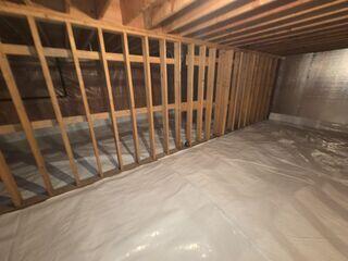 Encapsulated CleanSpace crawl space with SilverGlo insulation panels