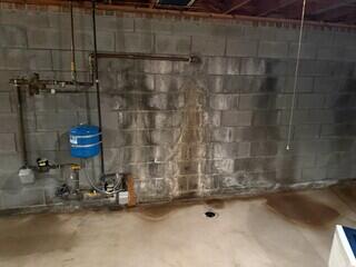 Water stains and efflorescence appearing on the walls indicated that there was major water damage done to this basement. The homeowners decided to schedule a free estimate with Cleveland Basement Systems so that they could find a lasting solution that would prevent this from happening any further.