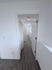 Through this door there will be a sliding closet door to the left wall and then on a bedroom straight on