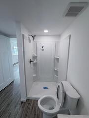 Nice shower with plenty of places to put products