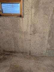 This small basement window was leaking whenever water pooled up outside of it. The homeowner also didn't like how small the window was.