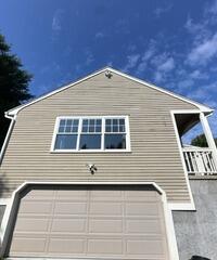 See how we solved severe siding peeling and roofline accessibility challenges for this Newtown, CT home with a complete exterior repaint and trim refresh.