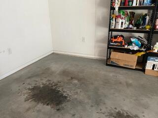 Before repairs, the garage floor showed noticeable uneven areas and low spots where the concrete had settled. These changes can happen when soil beneath the slab shifts or voids develop over time.