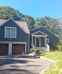 Thorough surface cleaning and prep work on siding and trim before the final coat of exterior pain