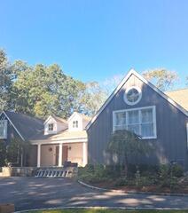 Active job site setup for full-house exterior power washing and high-reach prep work in Westport, CT