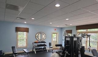 : After: Vibrant blue interior paint creates an energizing and clean gym atmosphere.