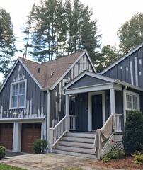 Work in progress: Skilled painters tackling high peak gables with thorough surface scraping and priming