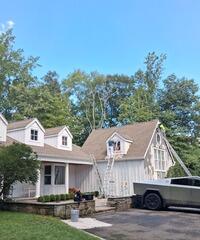 Work in progress: Freshly primed vertical siding ready for a smooth, high-durability finish coat