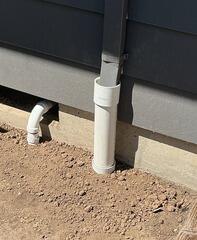 Sump Pump Discharge Connected to Existing Gutter Downspout Drain Line