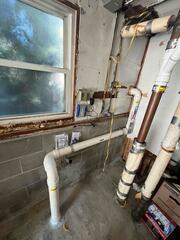 New interior radon mitigation piping installed as part of the one-point system.